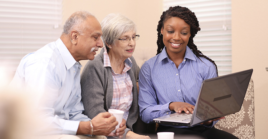 senior couple meeting with a senior living advisor