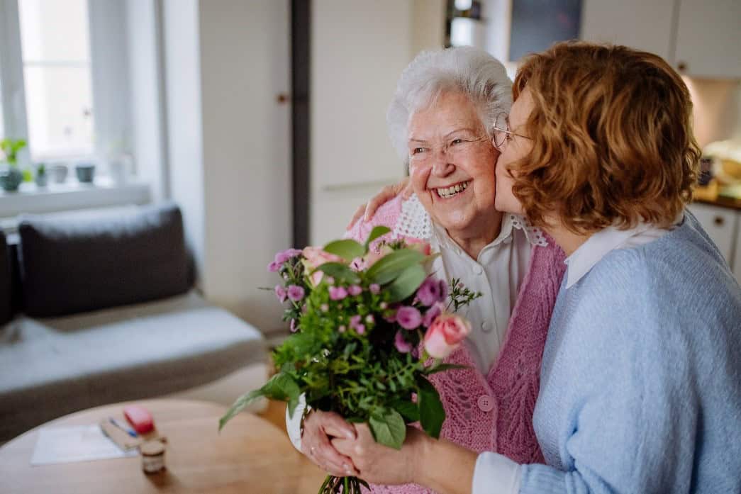 Happy Senior with flowers